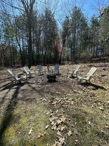 Enjoy the outdoors sitting around the firepit.