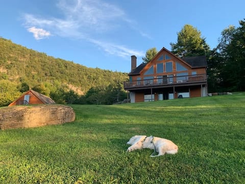 Looking back up at the house with the lake behind you.