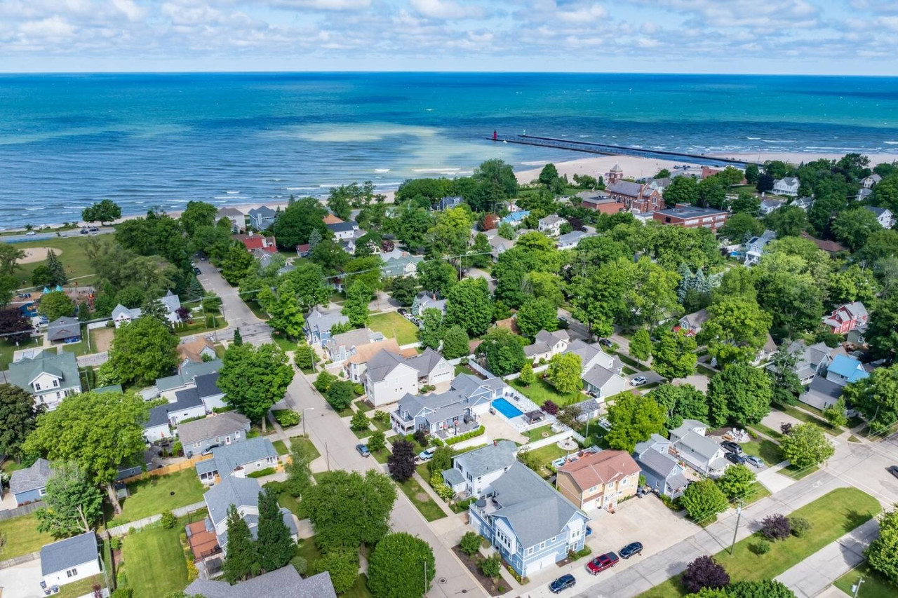 Take in the breathtaking aerial view of your entire property and Lake Michigan, offering a peaceful escape surrounded by nature.