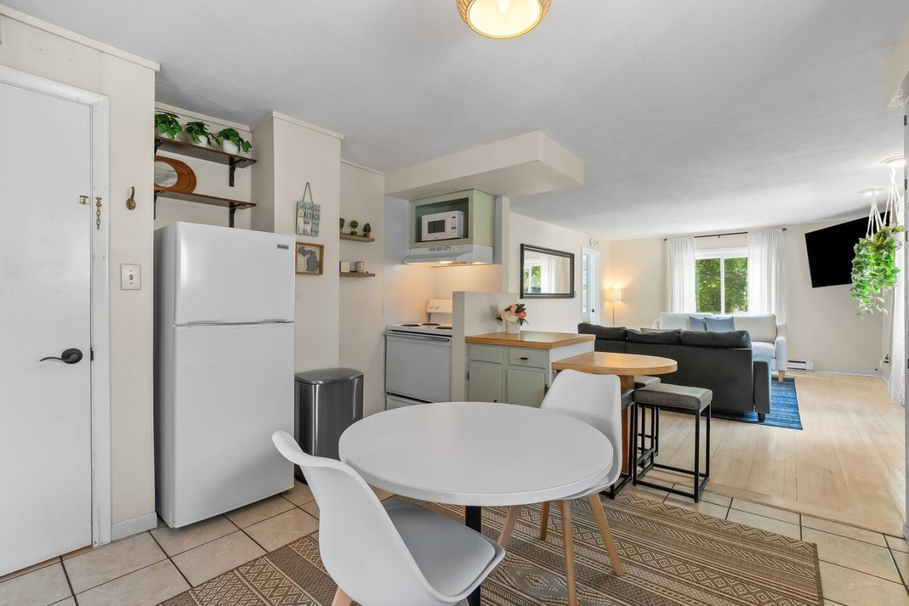 Enjoy a cozy and inviting dining experience in this charming kitchen and dining area, perfect for preparing and sharing your favorite meals.