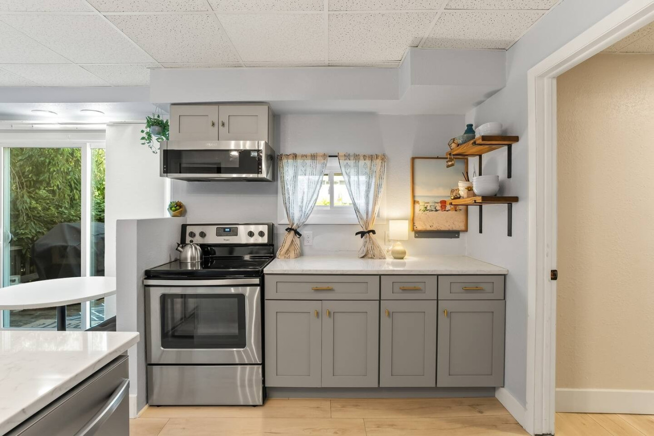 Prepare your favorite meals in this inviting kitchen, where space and style make cooking feel effortless.