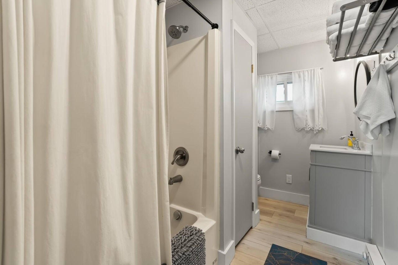 Relax in this cozy bathroom, designed to provide the perfect retreat after a day of fun by the lake.