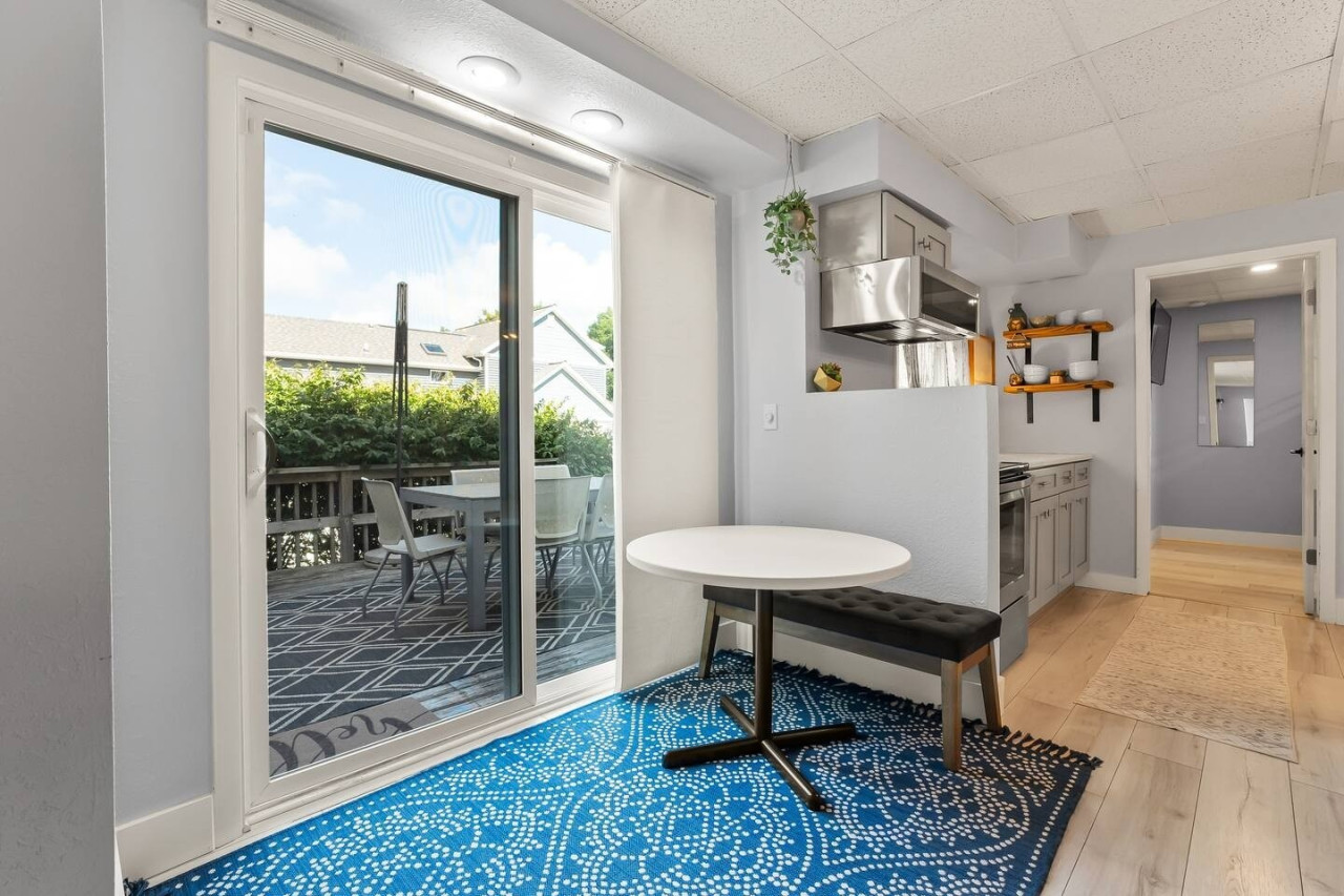 Start your day with a cozy breakfast at this charming table, perfect for a quiet moment or enjoying a meal with a view.