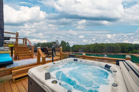 Soak in the hot tub while enjoying peaceful views of the pond!