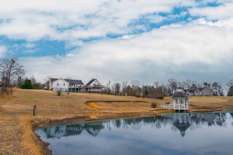 A stunning view of the pond with your cozy retreat just steps away!