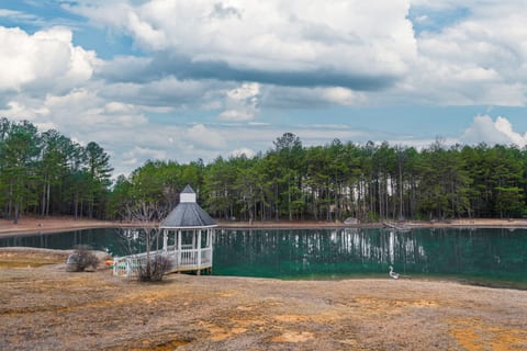 A perfect spot to relax—enjoy the pond views from the charming gazebo!