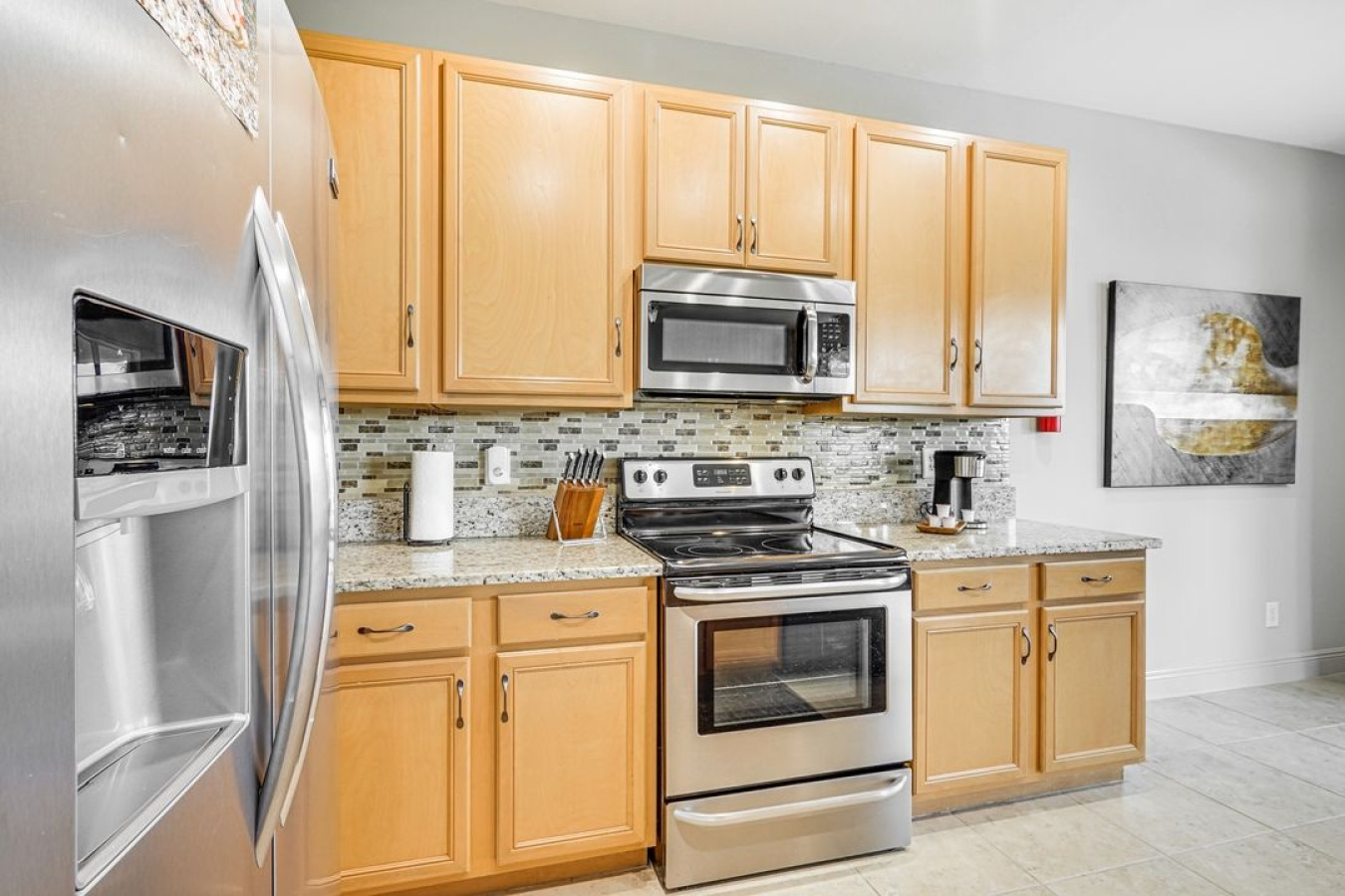 A clean and well-equipped kitchen, perfect for preparing meals and enjoying time together