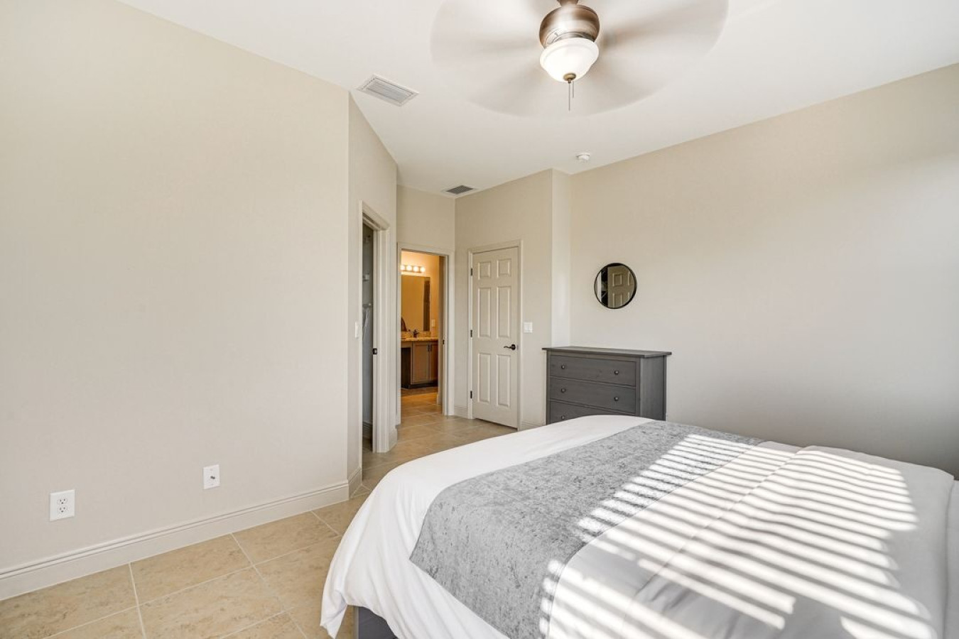 Sleep in comfort and wake up refreshed in this peaceful master bedroom, designed for ultimate relaxation.