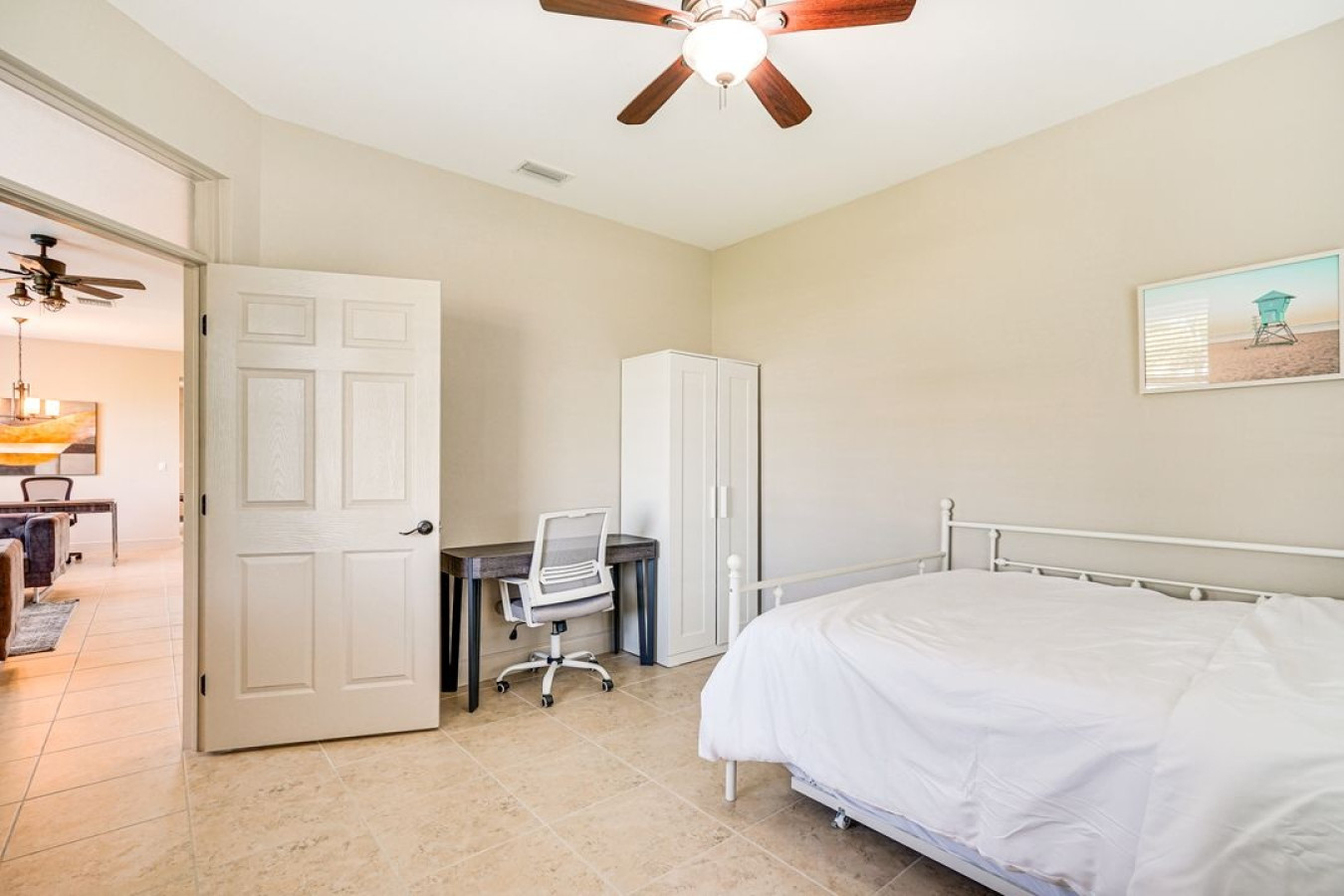 A cozy bedroom with a dedicated workspace—perfect for work and relaxation.