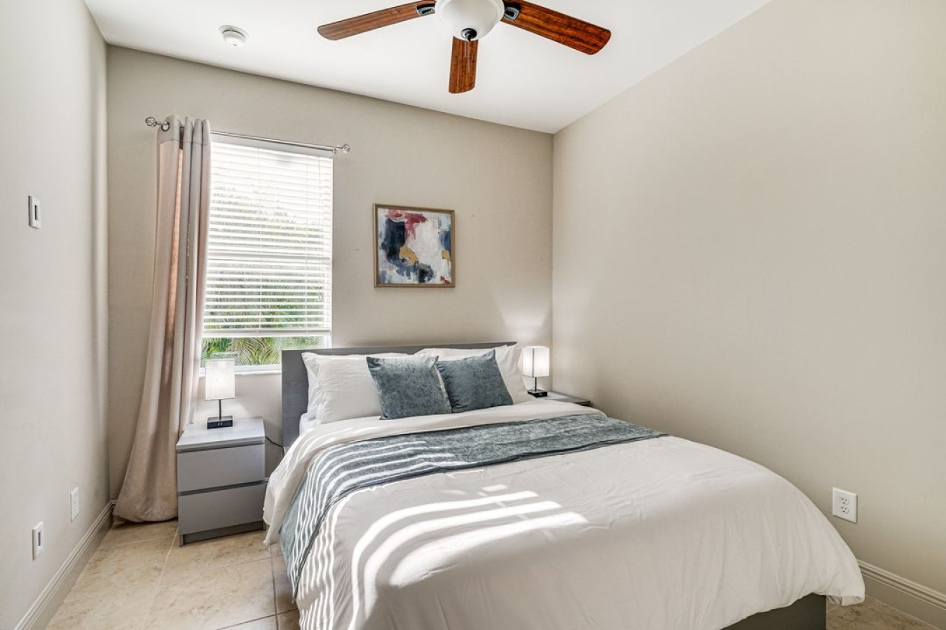 Wake up to warm natural light in this cozy and inviting bedroom.