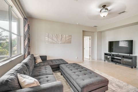 Unwind in this sunlit living room, where cozy seating and a relaxing atmosphere make it the perfect spot to recharge.