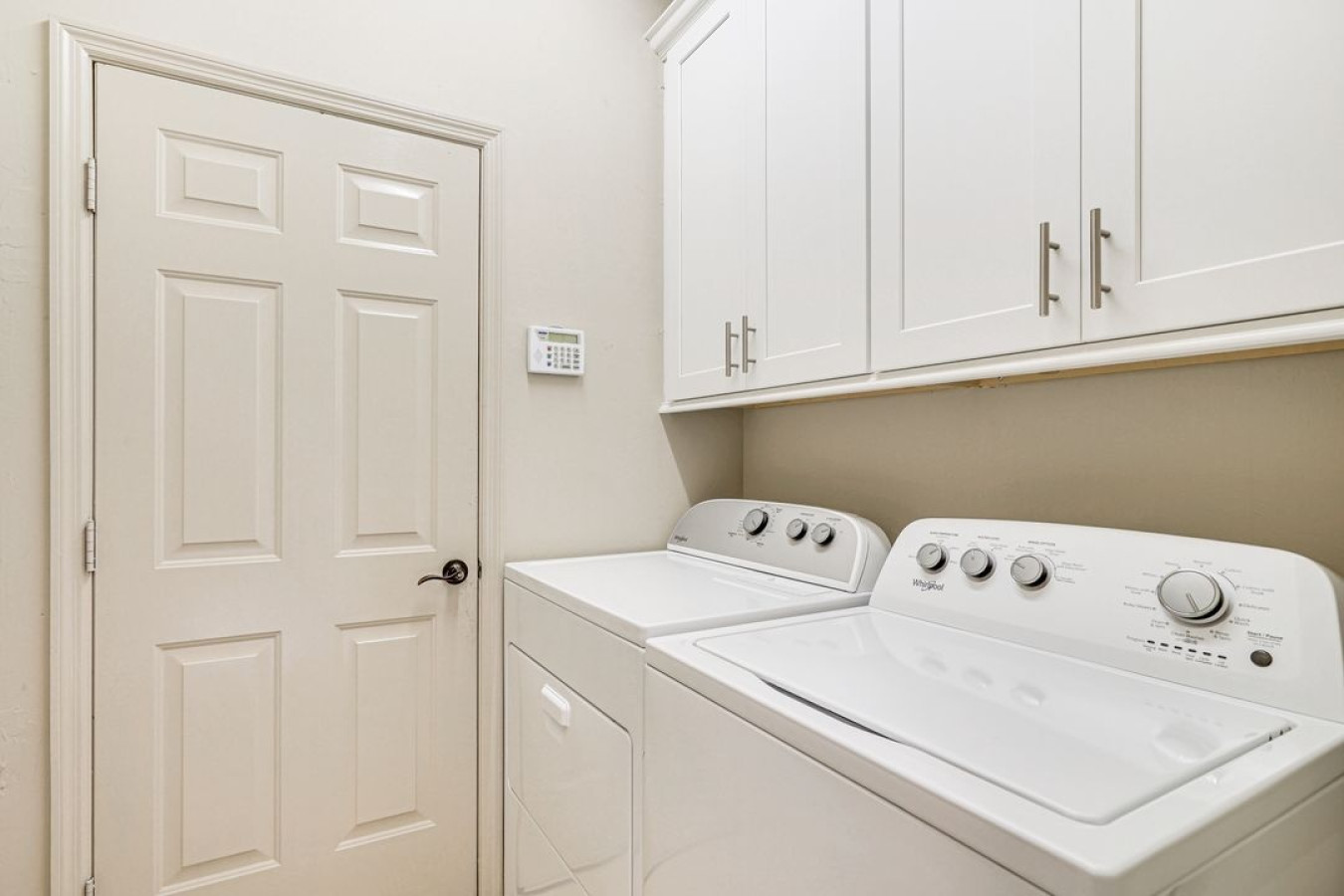 A convenient laundry room with a washer and dryer to keep your clothes fresh during your stay.