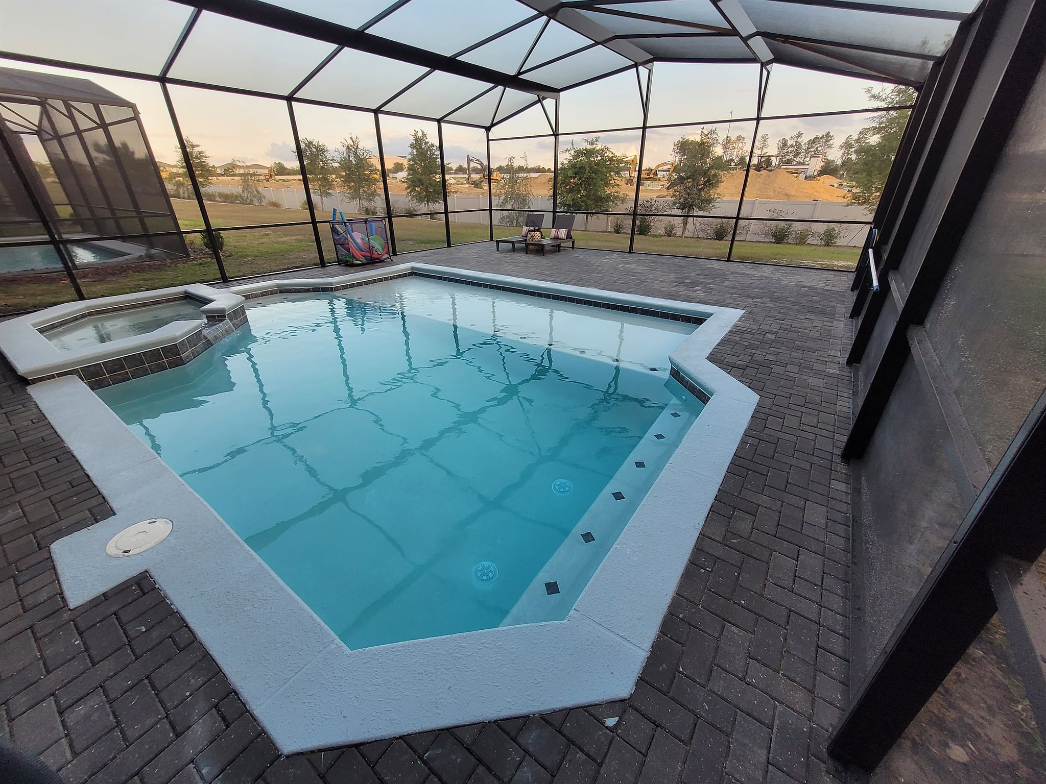 Huge pool with new sun shelf and extended lanai. More furniture arriving soon!