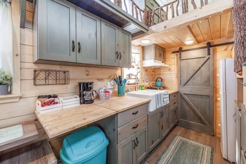 butcher block counter tops with flip down counter, soft close cabinets, coffee/tea station and snacks