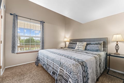 Unpack and exhale in the main-level king bedroom after a full Branson day.
