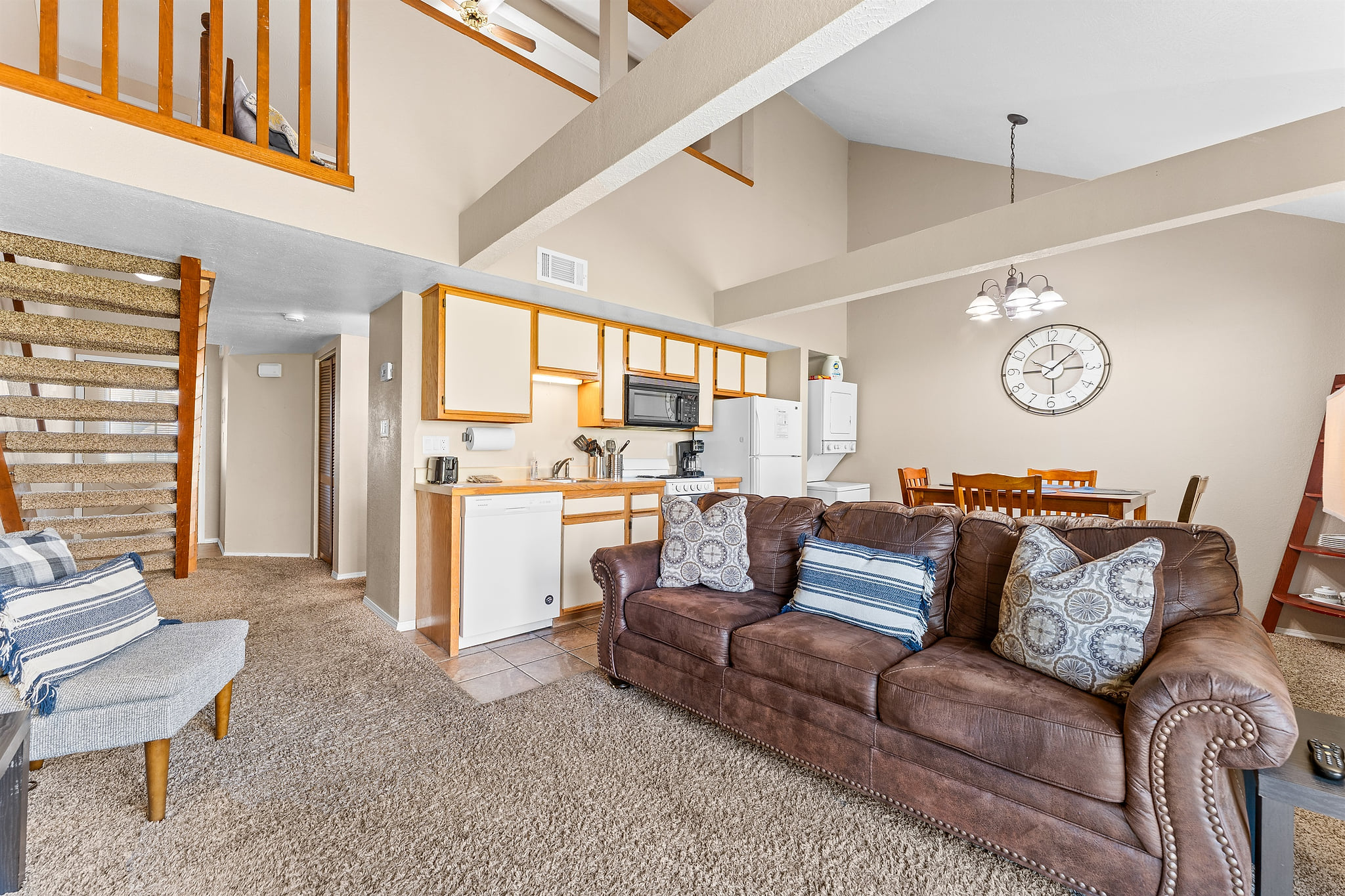 Open-concept living, dining, and lofted ceilings create a roomy, relaxed feel.