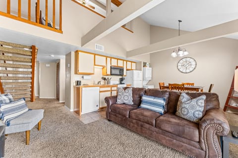 Open-concept living, dining, and lofted ceilings create a roomy, relaxed feel.