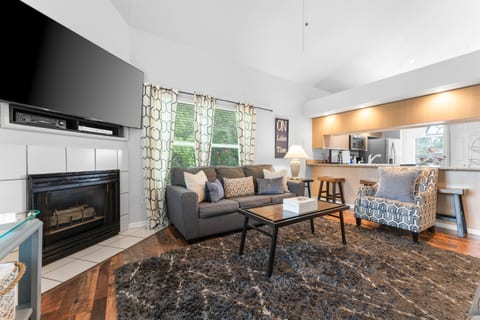 Unwind in the spacious living room with plush couches and a large smart TV for your entertainment.