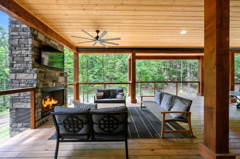 This deck is not just a deck – it's a destination! With a charming fireplace and plush furniture, it's the perfect spot to unwind with friends, a good book, or a favorite beverage in hand.