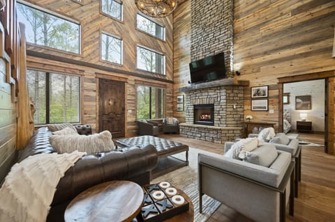 "Luxurious Rustic seating awaits in our cabin's heart, where comfort meets serenity."