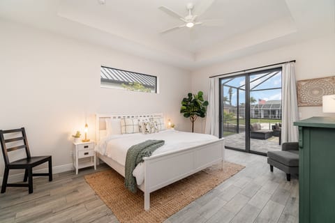 Master Bedroom Suite with King bed and private access to pool patio
