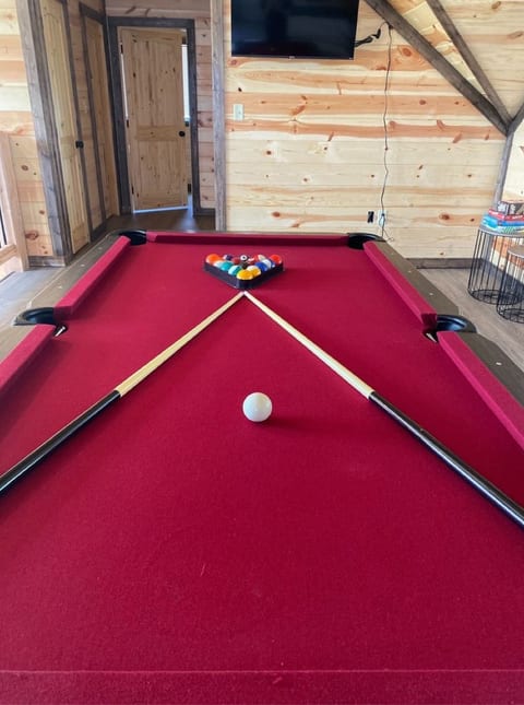 Upstairs fun starts here — the loft features a second pool table and Smart TV for extra hangout space.