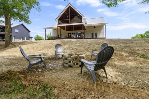 End your day around the fire pit with comfy chairs, river views, and plenty of space to unwind.