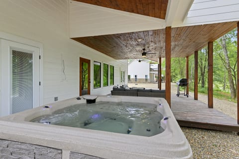 Relax on the lower deck in the private hot tub — it’s the perfect spot after a day on the river.