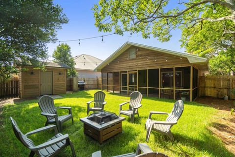 Backyard Garden. Enjoy the cozy backyard with string lights, a fire pit and a BBQ grill setup. Space to enjoy for kids, animals and adults. Fully enclosed and safe for littles to hang out in!