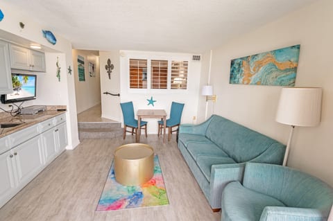 - Bright and inviting space with a cozy sitting area and a dining nook for intimate meals - Vibrant coastal accents bring a fresh, modern feel to this beachside retreat - Whether enjoying a quiet evening or entertaining, this space is designed for comfort