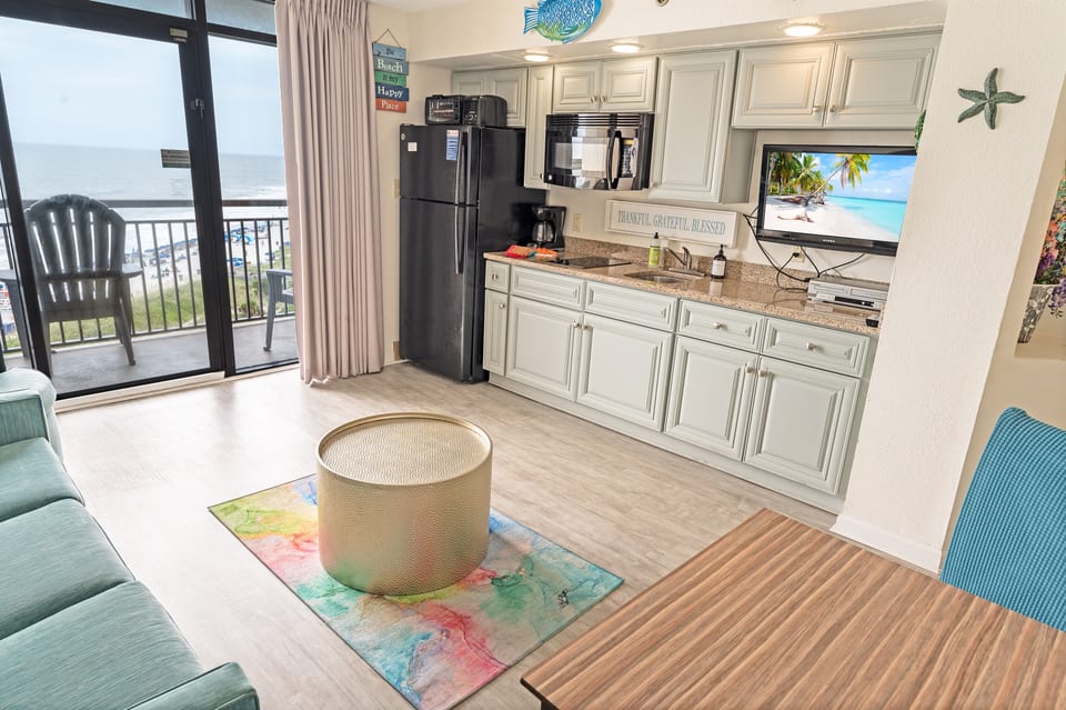 - Seamless blend of comfort and convenience in this beautifully designed space -Enjoy a fully equipped kitchen with modern appliances while staying connected to the oceanfront views - Perfect place to cook, dine, relax all in one open and inviting layout