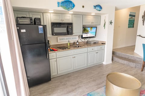 - A bright and inviting kitchen with coastal-inspired accents and modern appliances - Plenty of storage, counter space, and natural light make this a perfect spot for meal prep - Designed for convenience, so you can spend more time enjoying the beach