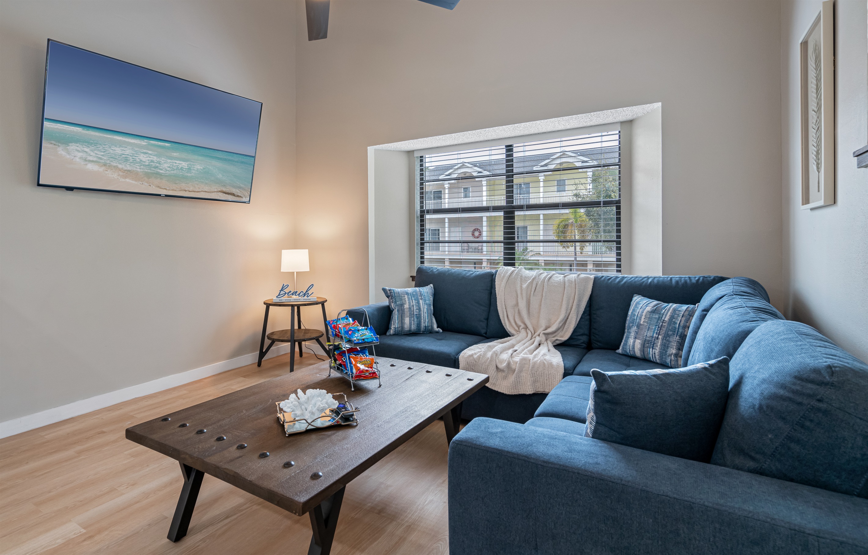 Featuring a plush blue couch that beckons you to sink in and relax.