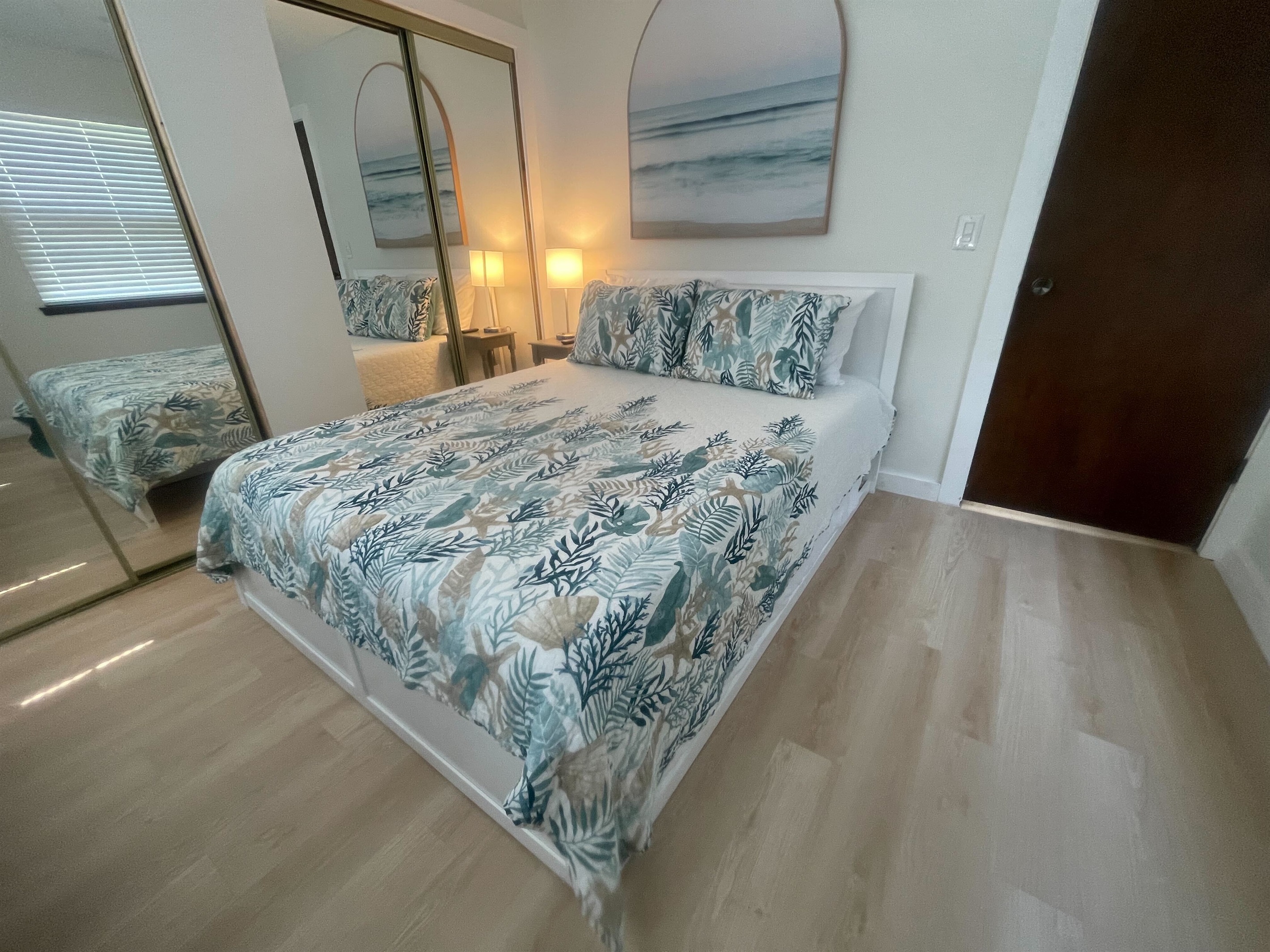 Welcome to our inviting bedroom featuring a cozy queen-size bed. Step into a space designed for comfort and relaxation, where you can unwind and recharge during your stay.