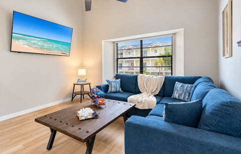 Featuring a plush blue couch that beckons you to sink in and relax.