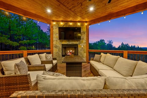 Enjoy the gas fireplace on the back deck along with 2 flat screen televisions.