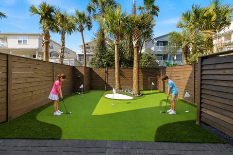 Brand new backyard putting green at Azure — perfect for practicing your short game or enjoying a little friendly competition.