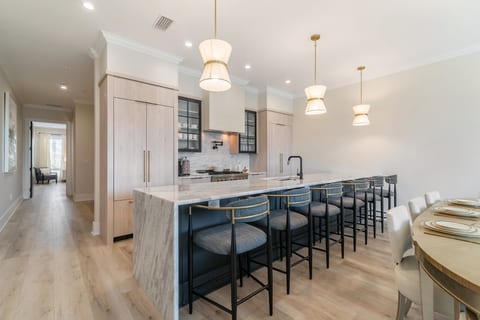 Sleek and modern kitchen with oversized island with seating for 6