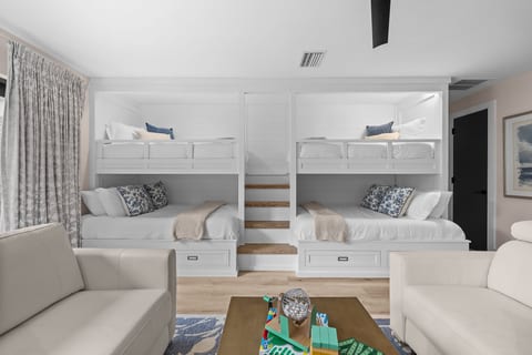 Custom built-in bunk beds, with storage, create a fun and comfortable sleeping space for families and groups.