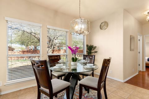 Our dining table is spacious, providing ample room for entertaining and gathering. The carefully chosen furniture and decor create a warm and welcoming environment, perfect for hosting intimate dinners or larger gatherings.
