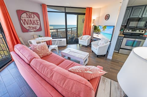 - Cozy living room with warm decor and plenty of natural light, open layout makes it perfect for relaxing - Comfortable seating, stylish touches, and a seamless indoor outdoor feel - Step onto the balcony for fresh air and stunning ocean views
