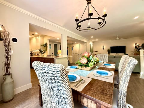 The dining table easily seats 6 for meals.