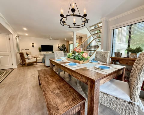 The dining table easily seats 6 for meals.