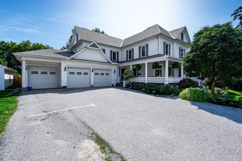 One parking spot available for each suite along the left hand side of the driveway.