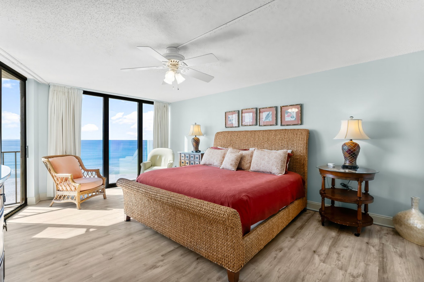 This beautifully designed beachfront bedroom features a spacious king-size bed, breathtaking ocean views, elegant coastal decor, and abundant natural light for a serene and relaxing retreat.