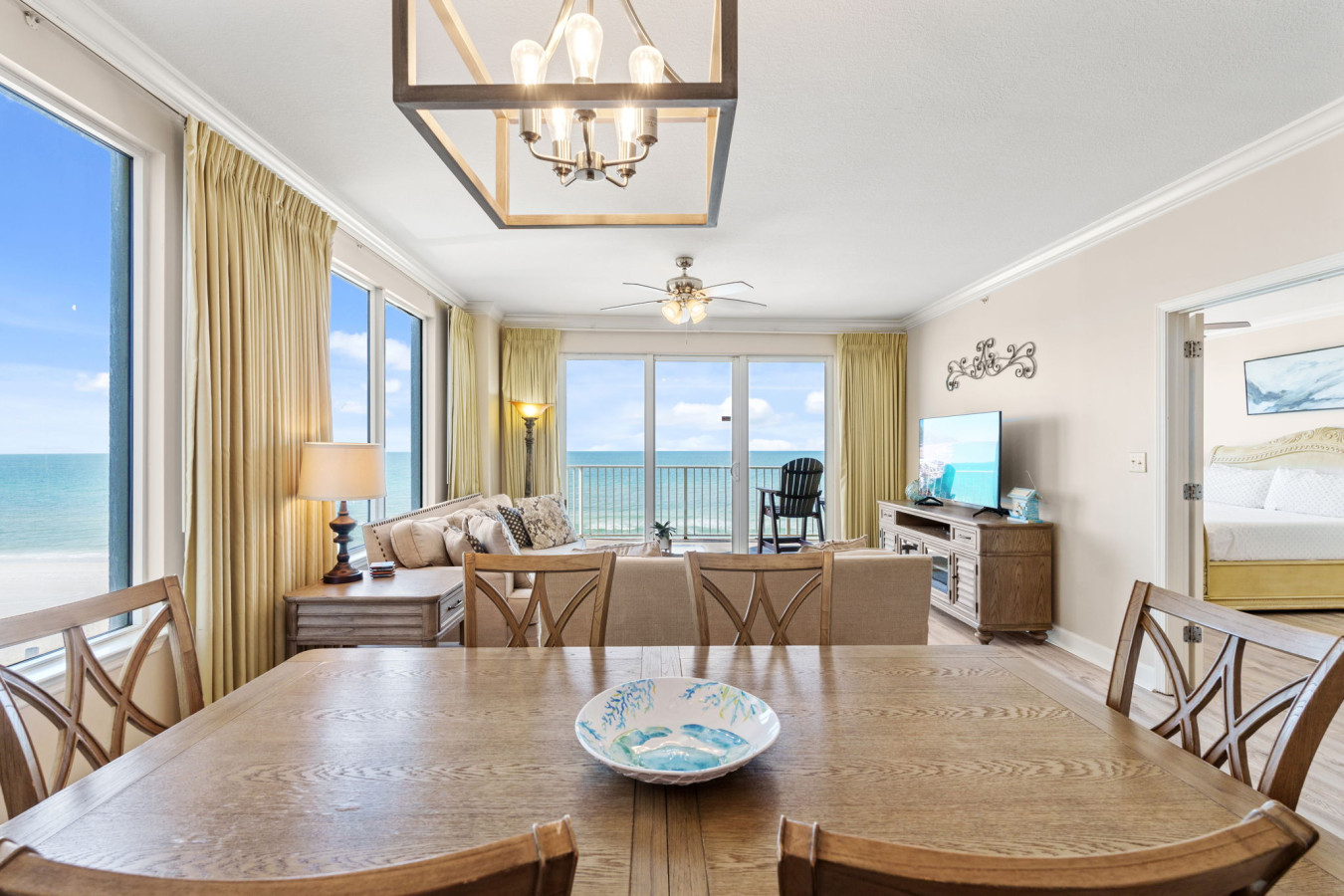 Enjoy meals with a view at the dining table, framed by floor-to-ceiling windows that showcase the breathtaking Gulf.