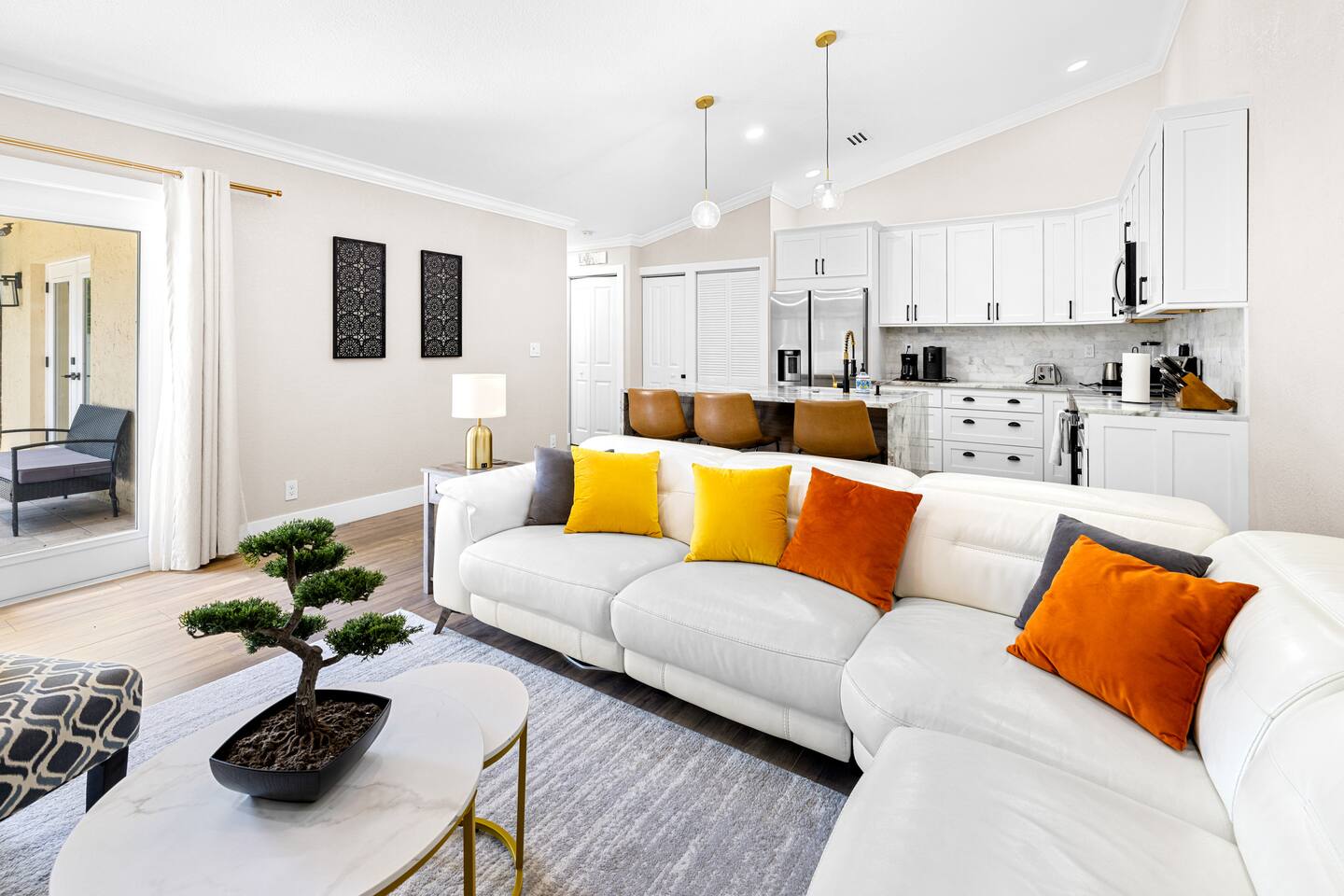 Sink into a luxurious living room escape with modern decor, organic elements and plenty of space to create beautiful memories with friends and families.