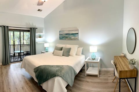 Off the living area is a large bedroom with a king size bed/new king mattress and attached full bathroom. A workspace is included, which doubles as a vanity!