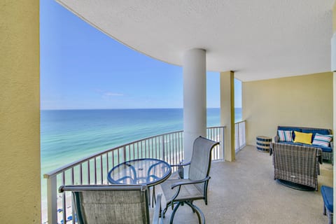 Enjoy breathtaking ocean views from this spacious beachfront balcony, complete with cozy seating and a bistro table—perfect for sipping coffee at sunrise or unwinding at sunset