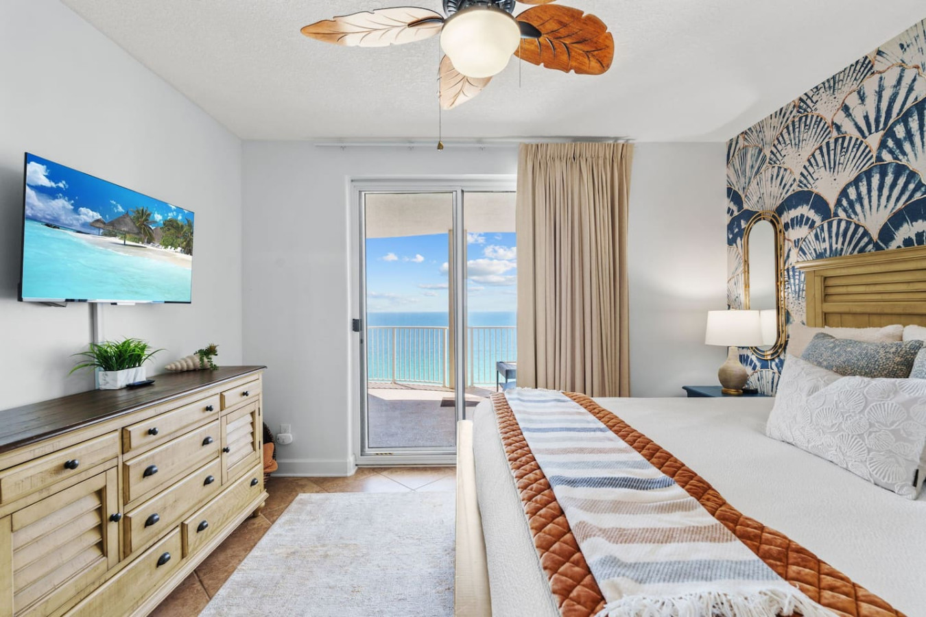 Wake up to breathtaking ocean views at Ocean Ritz, where this stylish beachfront retreat offers a cozy king-sized bed, private balcony, and tropical-inspired decor